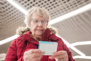 Senior patient picking up medicines at a pharmacy