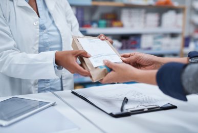 Closeup shot of a pharmacist assisting a customer with prescription