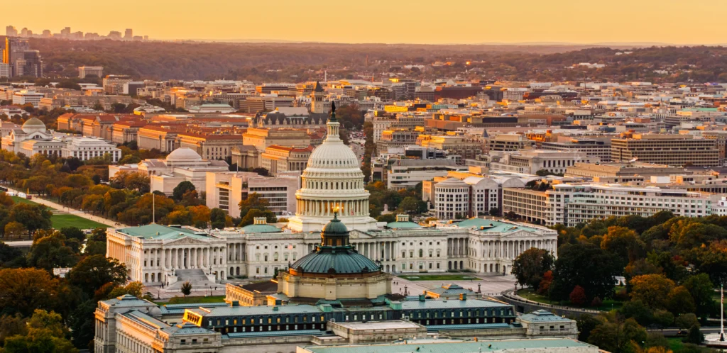 Aerial Shot of U.S. Capitol Building and Library of Congress at Sunset